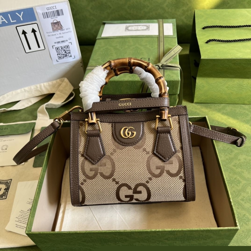 G*u*i top handle bags